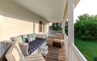Virginia farm porch has a day bed perfect for naps at Sunset Farm Stay vacation rental in Crozet Virginia